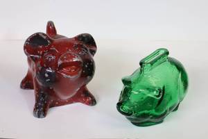 lot 381 image: Collectible Cast Iron Red Locking Bank Pig, green Depression Glass Pig Piggy Banks