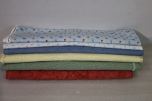 lot 432 image: Bulk Quality Quilting FabricThimbleberries Blue Skies & Late Summers for RJR Fashion, Itsy Bitsy for Chanteclaire, Mary Engelbreit Quilting Treasures By Cranston, Kym Bowles Marcus Brothers, Rhubarb & Ginger By Blackbird Designs Moda