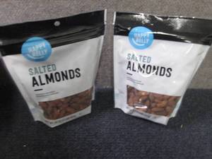 2- 16 oz Happy Belly Salted Almonds...