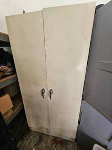 lot 438 image: Old Tan Metal Garage Cabinet