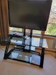 lot 74A image: Tempered Glass and Black Entertainment Stand