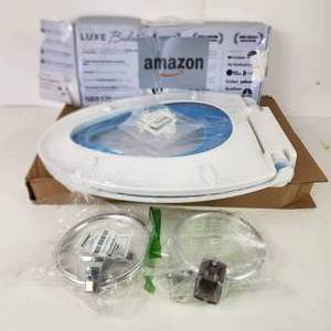 lot 8 image: Plumbing Items Elongated Toilet Seat With Child Seat Towel Rings And Luxe Bidet New Open Box