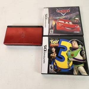 lot 52 image: Nintendo DS Lite Two Games Toy Story And Cars No Charging Cord Was Tested Great Condition