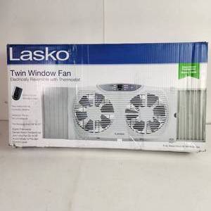 lot 54 image: Lasko Twin Window Fan Electronically Reversible With Thermostat Multi Function Remote Control Expander Panels Damaged Box