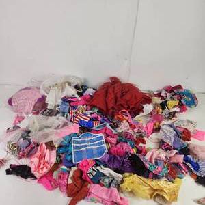 lot 89 image: Barbie Doll Clothes and a lot more