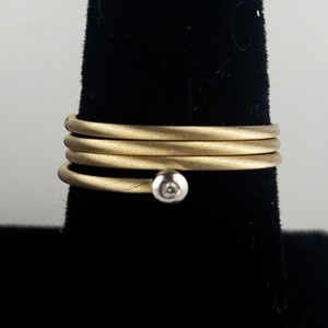 lot 4 image: Bezel Set Solitaire Diamond Platinum & 14K Yellow Gold Wrap Ring. Size 9-9.5. Low Reserve