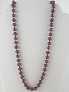 lot 12 image: Faceted Ruby Silver Tone Base Metal Knotted Bead Necklace. Replacement Value $600