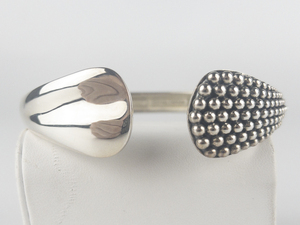lot 23 image: Michael Dawkins Tapered Dot Design Sterling Silver Hinged Cuff Bracelet.