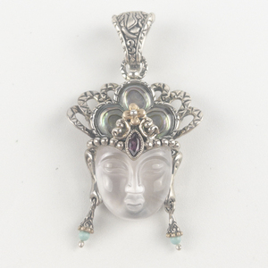 lot 54 image: Barbara Bixby goddess Quan Yin sterling and 18K yellow gold enhancer (no chain). Estimated Replacement value $350