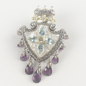 lot 55 image: Barbara Bixby Arrowhead Mother of pearl Multi-gemstone sterling and 18K yellow gold enhancer (no chain). Estimated Replacement value $500