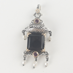 lot 57 image: Barbara Bixby Gemstone Pagoda sterling and 18K yellow gold pendant (no chain). Estimated Replacement value $325