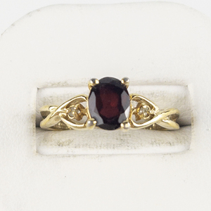lot 91 image: Lindberg  Garnet & Cz Gold Tone Base Metal Ring. Size 8.5 - 8.75.