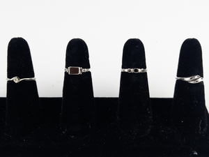 lot 122 image: Group of 4  Sterling Silver Rings. Size 6.75-7.75.