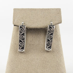 lot 128 image: Swirl Inlay Triangular Sterling Silver Hinged Wire Hoop Earrings.