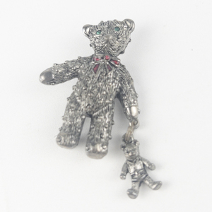 lot 192 image: Vintage Teddy Holding Swinging Teddy Silver Tone Base Metal Brooch .