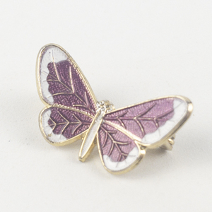 lot 202 image: Purple and White Enamel Butterfly Brass Brooch .