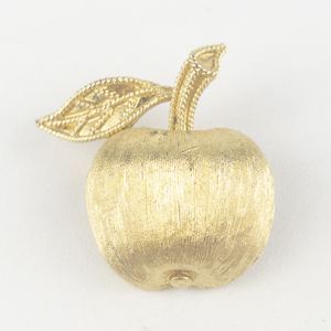 lot 204 image: Trifari  Apple With Leaf Yellow Base Metal Brooch .
