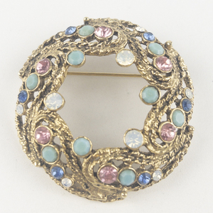 lot 210 image: Pink, Blue, Teal, & White Rhinestone Accented Wreath Gold Tone Base Metal Brooch .