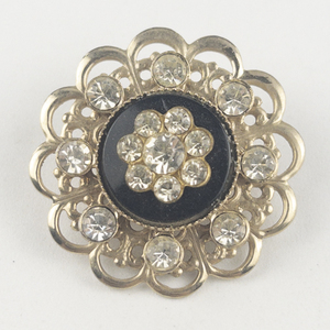 lot 212 image: Clear Rhinestone Floral Gold Tone Base Metal Brooch .