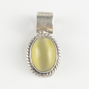 lot 242 image: Taxco, Mexico  Lab Grown Oval Cabochon Cats eye sterling silver pendant (no chain).