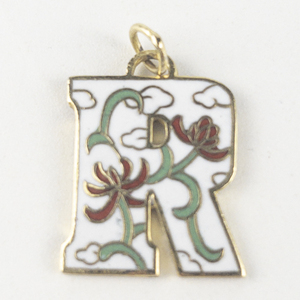 lot 248 image: Red, Green, & white Enamel R gold tone base metal pendant (no chain).