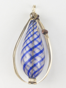 lot 253 image: New Old Stock Handcrafted large wrapped Blue & gold blown glassgold filled wire pendant (no chain). Replacement value $85