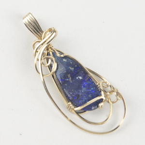 lot 255 image: New Old Stock Handcrafted large wrapped Boulder opal 14k Gold & gold filled wire pendant (no chain), set with boulder opal. Replacement value $165