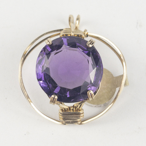 lot 258 image: New Old Stock Handcrafted large wrapped round brilliant cut amethyst gold filled wire pendant (no chain), set with amethyst . Replacement value $85
