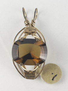 lot 259 image: New Old Stock Handcrafted large wrapped antique cushion cut Smokey quartz gold filled wire pendant (no chain), set with Smokey quartz. Replacement value $85