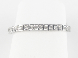 lot 277 image: Illusion Set Diamond Sterling Silver Tennis Bracelet.