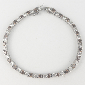 lot 295 image: Far East Gem & Jewelry  Brown (Smoky Quartz) & White Czsterling Silver Tennis Bracelet.