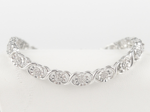 lot 302 image: Unique Designs  Illusion Set Diamond Sterling Silver Tennis Bracelet.