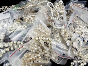 lot 335 image: Approx. 50 Faux Pearl Base Metal Necklaces & Bracelets.