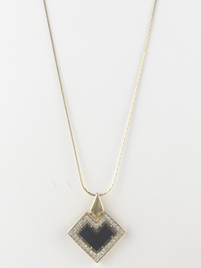 lot 356 image: Givenchy Cz Black Gold Tone Base Metal Heart Pendant Necklace.