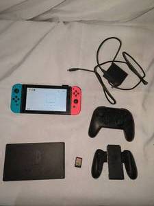 lot 146 image: Nintendo Switch Console Bundle with Joy-Cons, Pro Controller, The Legend of Zelda Game
