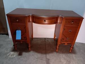 lot 75 image: Vintage Wooden Vanity Desk with Intricate Carving and Turned Legs