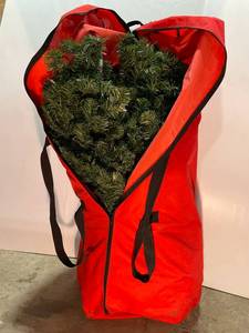 lot 83 image: Artificial Christmas Tree in Red Bag
