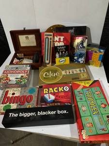 lot 104 image: Diverse Board Game Collection - Monopoly, Clue, Tripoley Junior, Racko, Cards Against Humanity Set