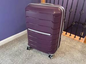 lot 23 image: Samsonite Large Purple Luggage Set