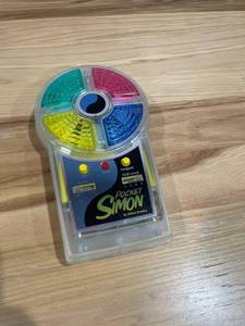 lot 213 image: Vintage Pocket Simon Game by Milton Bradley