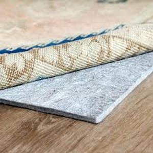 lot 43 image: RUGPADUSA Essentials 8 ft. x 10 ft. Hard Surface 100% Felt 12 in. Thickness Rug Pad  Customer Returns See Pictures