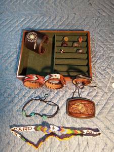 lot 30 image: Native bracelets, eagle belt buckle and 6 rings