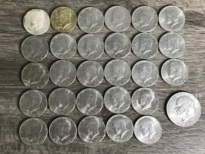 lot 306 image: Lot of 28 Kennedy Half Dollars and 1 Eisenhower Dollar - Dates listed in description
