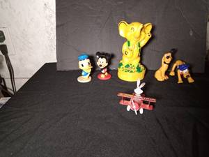 lot 127 image: Pennie Pincher bank from Bankers systems St. Cloud, MN - 1988 Ertl die cast Bugs Bunny Whats up Doc airplane - Walt Disney Mickey Mouse & Donald duck bobbleheads - 2 Walt Disney Plutos
