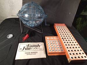 lot 163 image: 1971 Hasbro Cage Bingo game with cards, balls, cage, and ball placement board