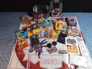 lot 173 image: Pokmon trading card game with board, cards and gaming pieces in its original tin
