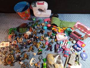 lot 174 image: Monster high items, character figures, Hot dog cart, Hello Kitty tin, Childs sewing machine, Dr, Seuss pail, bean bags, stickers and more