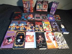 lot 206 image: Specialty VHSs - Led Zepplin, Elton John, Motley Crew, Doors, Willie nelson, Johnny Mathis, Barbara Streistrand, X-men, 007 set, Monty Python set