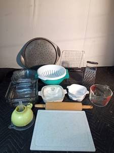 lot 230 image: Casseroles, strainers, pizza pan, cutting board, rolling pin, pie pans, grater, cooling racks, measuring cup, and funnels