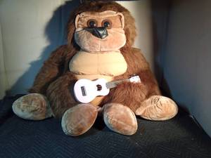 lot 231 image: Huge plush ape with guitar